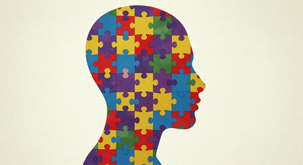 Human head silhouette filled with puzzle pieces symbolizing autism spectrum disorder