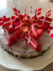 birthday cake with strawberries and flags