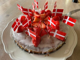 birthday cake with strawberries and flags