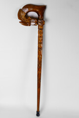 Beautifully carved wooden walking stick with intricate design and animal motif