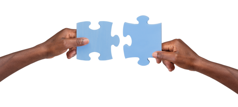Man holding and matching two pieces of jigsaw puzzle, isolated on white or transparent background