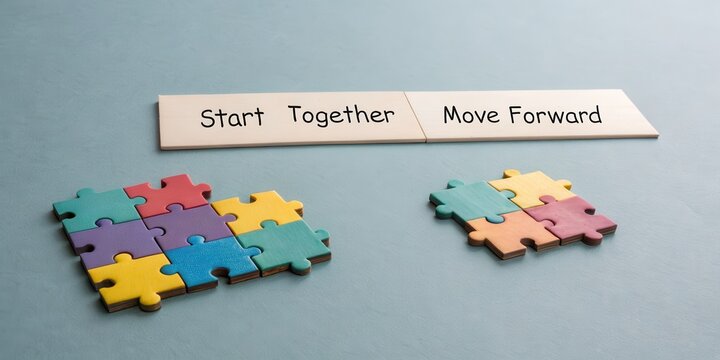 Puzzled pieces coming together symbolizing teamwork and progress - Powered by Adobe