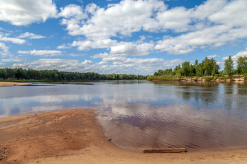 Calm lake with a cloudy sky in the background