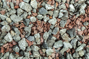 Pile of rocks with some red and gray ones