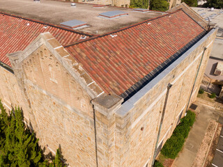Daytime Drone Images of a High School Built in the 1920's With A Tile Roof and Masonary Walls