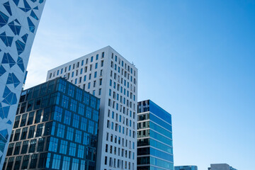 Cluster of modern office buildings in Oslo Norway with glass and steel design, clarity and corporate identity background for editorial and branding purposes