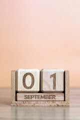 Wooden calendar showing september 1 date concept