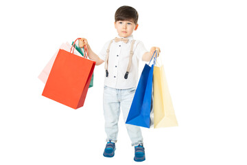 Little boy with colorful shopping bags, front view