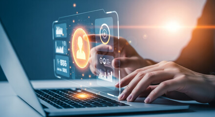 Person using a laptop with a futuristic holographic interface, showcasing data visualization.