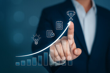 Business growth strategy concept with professional hand pointing on digital chart, innovation icons, success trophy and upward performance analytics