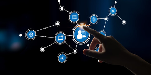 A hand interacts with a digital network interface featuring various icons. This image symbolizes technology and social connections, highlighting modern digital communication. Tessel