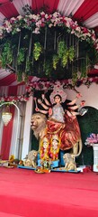 Idol of Goddess Devi Durga at a decorated puja pandal , Durga Puja is a famous and major religious traditional festival of Hinduism that is celebrated throughout the world.
