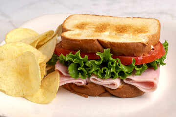 ham sandwich with a side of  fries