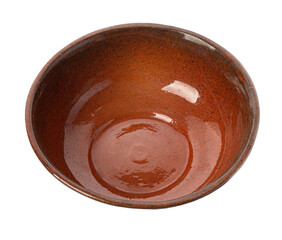 Empty brown clay bowl, handmade and rustic, seen from above