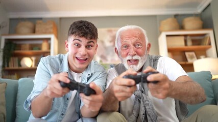 Grandson and grandfather winning video game together - Powered by Adobe