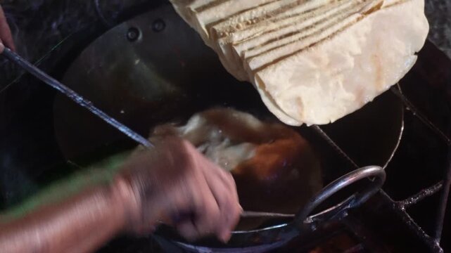 papad being fried in hot oil