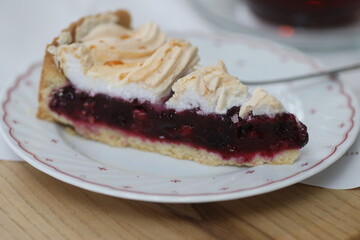 Slice of pie with whipped cream on top