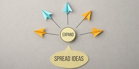 Origami arrows representing ideas expanding outwards