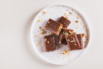 Close up of protein bars with nuts on plate  on table top view