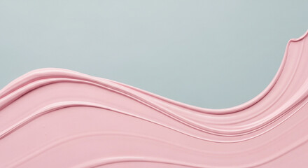 Smooth pink cosmetic cream texture flowing elegantly across a soft blue background, perfect for beauty product advertising