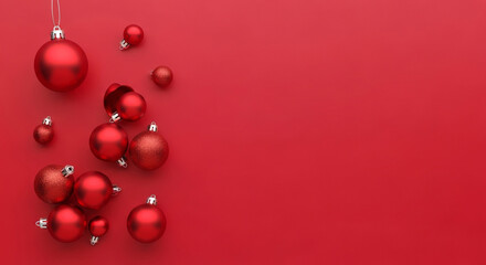 Sparkling festive red Christmas ornaments scattered on a vibrant crimson background creating a cheerful holiday celebration atmosphere