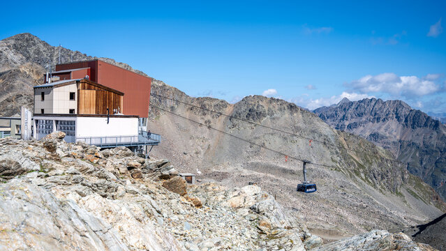 Ride the Diavolezza Cable Car for stunning views of the Bernina Range and glaciers. Located in Graubunden, Switzerland, this alpine adventure offers breathtaking mountain scenery.
