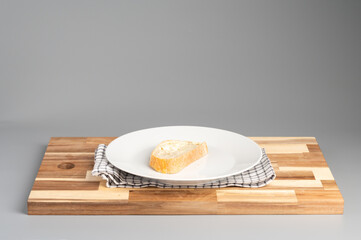 Slice of Bread on Plate with Checkered Napkin