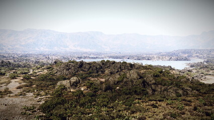 A large body of water surrounded by mountains