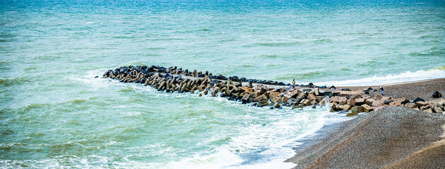 The waves crash loud, yet the moment speaks softly.