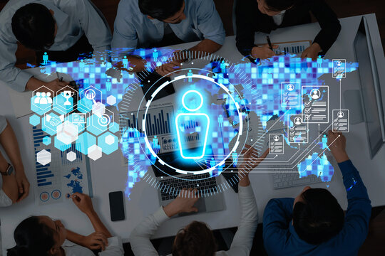 A group of professionals engaged in a collaborative meeting featuring digital tools and data visualizations, highlighting interactive global connections and innovative strategies. Trope