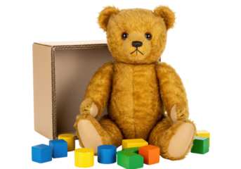 Vintage teddy bear with colorful wooden blocks and cardboard box isolated, childhood memories and classic toy concept