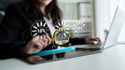 A concept of a system update and software installation. A progress bar and loading icons showing...