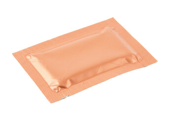 Small peach-colored rectangular sachet isolated on a clean backdrop, single-use packet for cosmetics or pharmaceuticals PNG