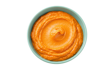 Vibrant orange pumpkin puree in a bowl isolated on transparent background, healthy food concept for cooking and baby food