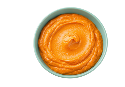 Vibrant orange pumpkin puree in a bowl isolated on transparent background, healthy food concept for cooking and baby food