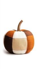 Cozy textile pumpkin with stitched patchwork design, rustic seasonal craft isolated for decor.