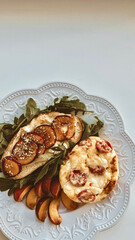 Toast with Camembert cheese, omelette, plum and arugula