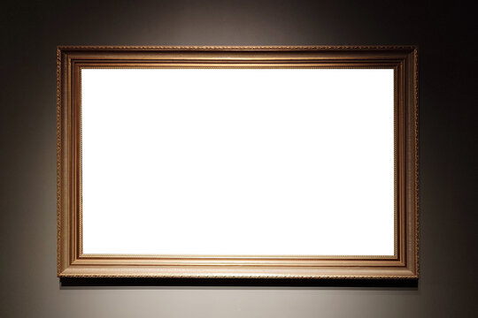 Blank golden picture frame on museum wall