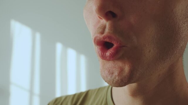 A man whistles with his lips, a man's whistle