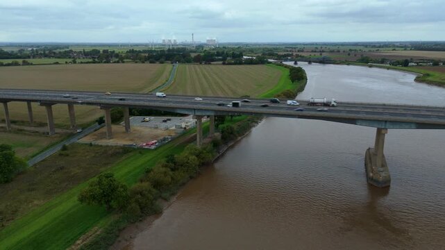 Aerial drone view of motorway highway bridge over the river Trent, lots of traffic near Goole, Yorkshire, UK