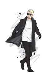 Young man in winter clothes holding snowboard in studio