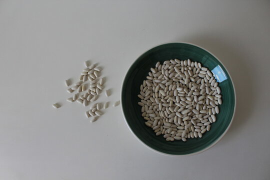 Composition with a bowl of organic beans. Horizontal toto with space for text.