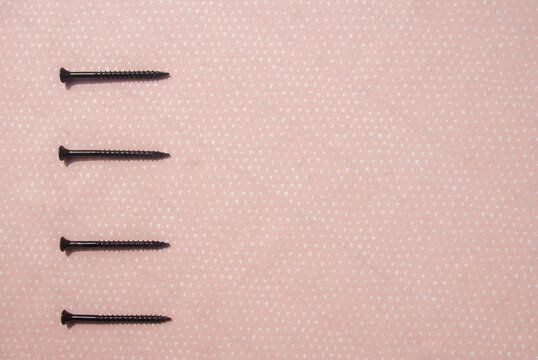 Four bullet points using nails on a pink background
