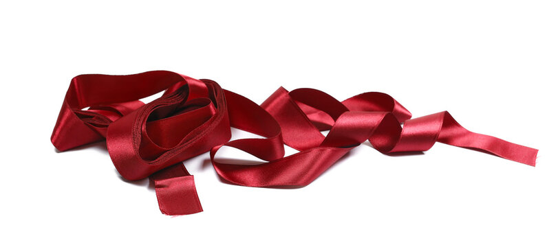 Red ribbon roll curly isolated on white, clipping path