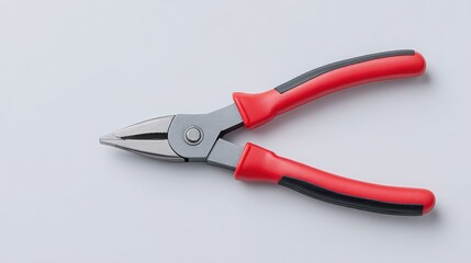 Obraz premium Pliers with red handles on a neutral background, ideal for tools and DIY projects.