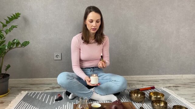 Woman lighting incense for meditation and spiritual practice