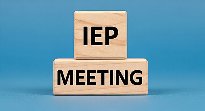 Wooden blocks spelling out iep meeting on a blue background for special education advocacy concept