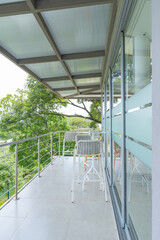 Modern terrace with bar stools and tropical view in Costa Rica