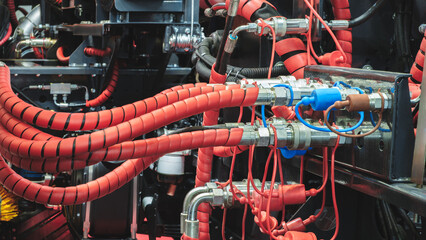 Hydraulic power drive hoses of high pressure machine, industrial power concept background.