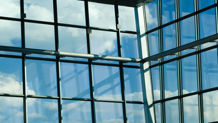 Large window with blue sky and clouds. sky is clear and bright, and the clouds are scattered...